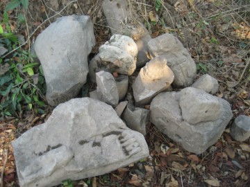 Fragments of Buddha statues and stucco