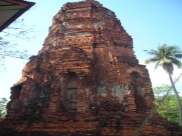 Reclining Buddha behind a monastic structure